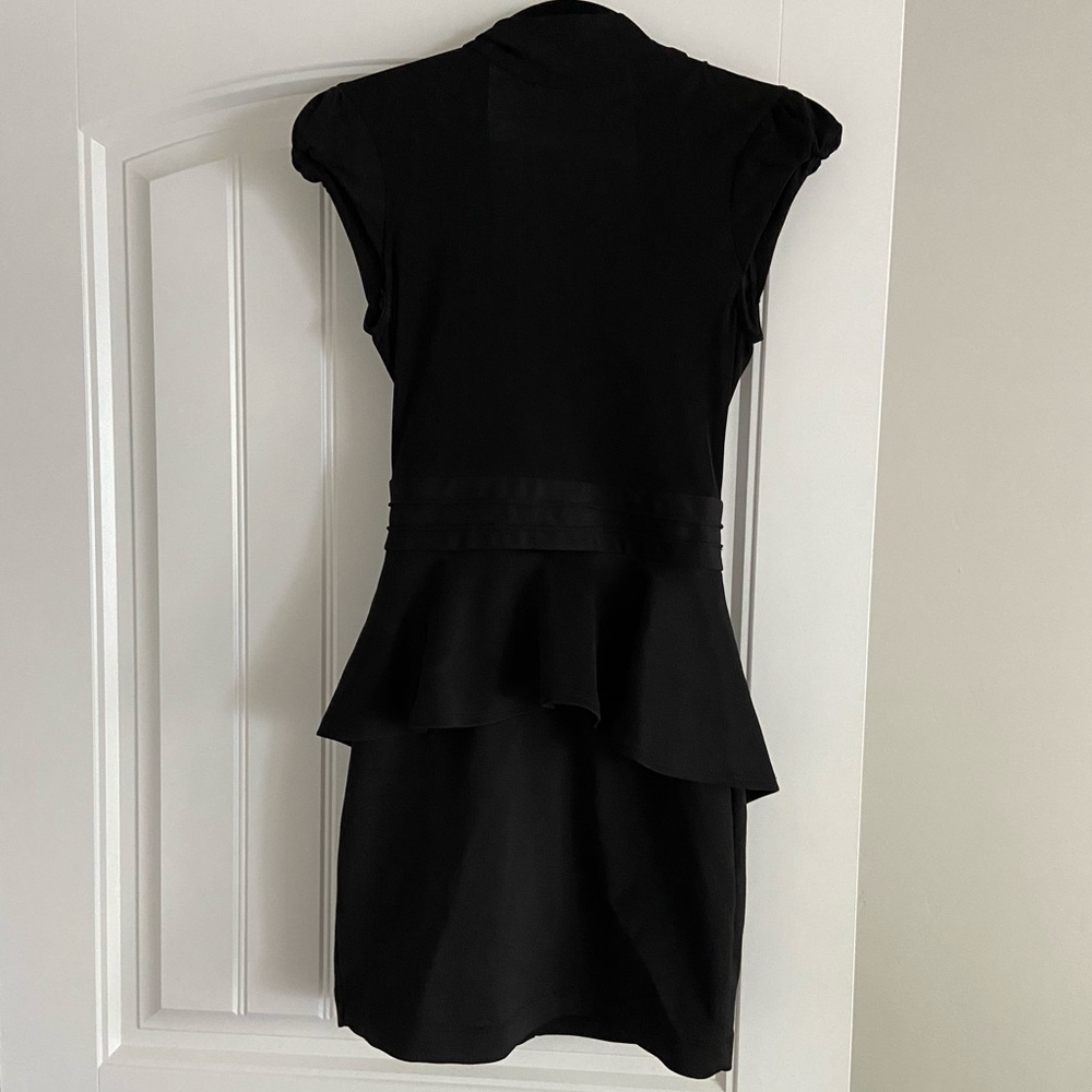 High neck, open back, peplum mini dress